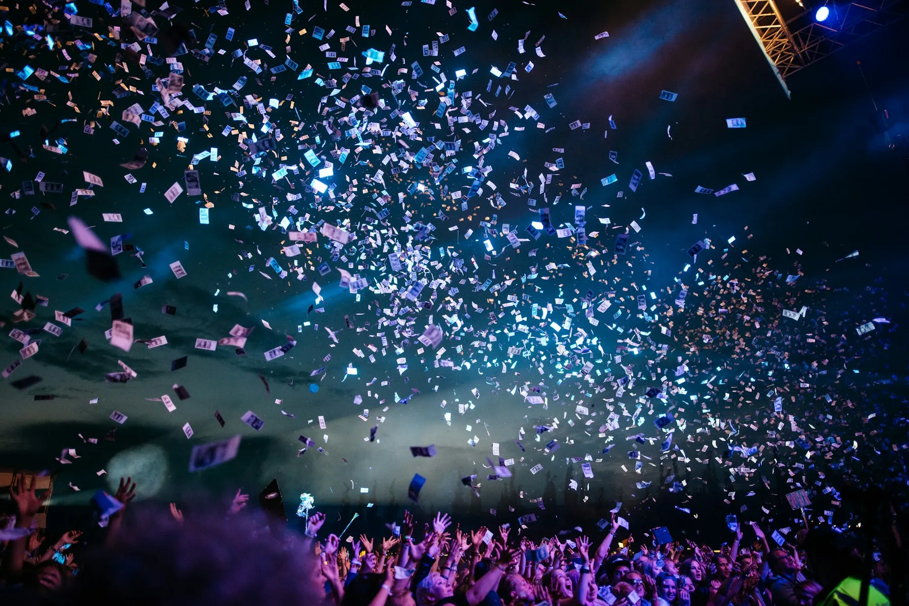 Confetti falling over a celebrating crowd